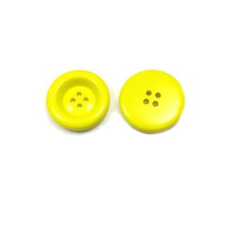 Round greenish yellow plastic button - diametre 30 mm