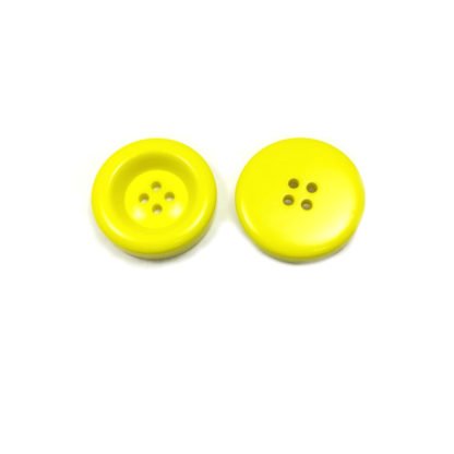 Round greenish yellow plastic button - diametre 30 mm
