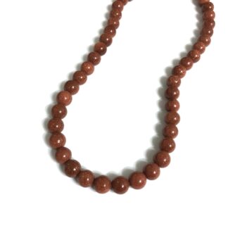 Glittery round brown stone beads by strand - diametre 8 mm - length 37 cm