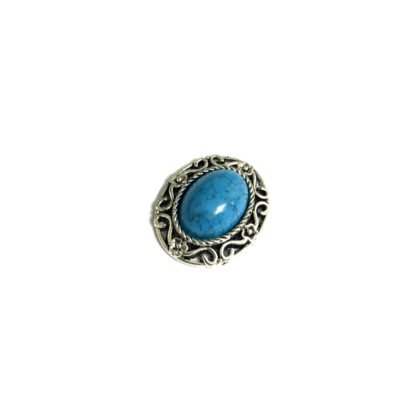 Silvery metal oval ornament with blue cabochon - size 24 x 29 mm