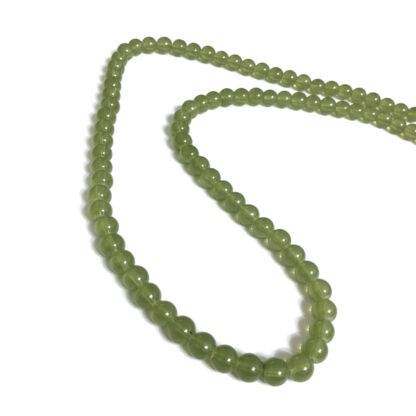 Round greyish green semi-transparent glass beads by strand - diametre 8 mm - length 82 cm