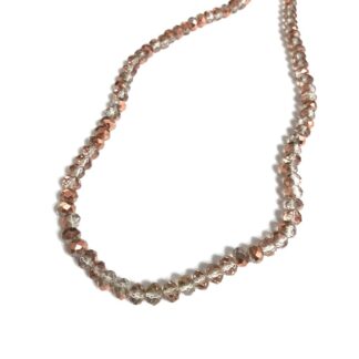 Faceted transparent golden pink beads by strand - diametre 6 mm - length 44 cm