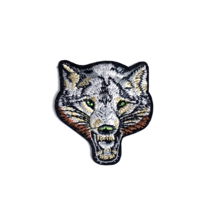 Grey and brown wolf head with green eyes iron-on garment sticker by piece - size 55 x 60 mm