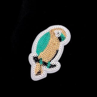 Golden black and green sequins parrot on white iron-on garment sticker by piece - size 52 x 62 mm