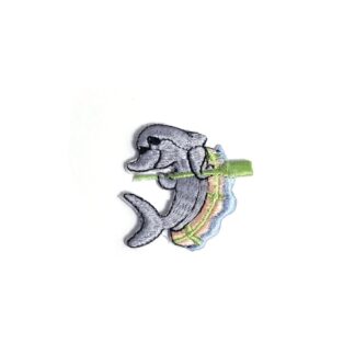 Grey dolphin on green and beige boat in blue water iron-on garment sticker by piece - size 50 mm