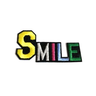 Colourful yellow white pink blue and green word Smile on black iron-on garment sticker by piece - size 35 x 72 mm