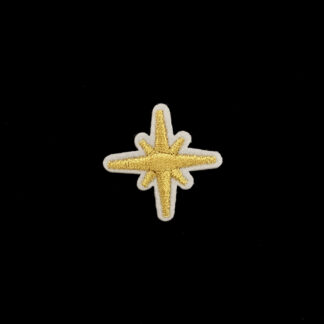 Golden star on white iron-on applique - size 32 mm
