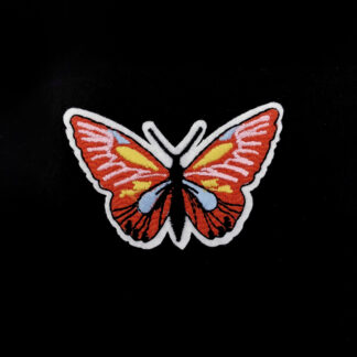 Black pink blue yellow and orange red butterfly on white iron-on garment sticker by piece - size 43 x 67 mm
