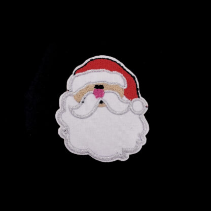 Red cream brown silvery and pink Santa head on white iron-on garment sticker by piece - size 52 x 62 mm