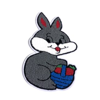 Red and grey rabbit with blue basket full of red and green carrots on white garment applique by piece - size 143 x 255 mm