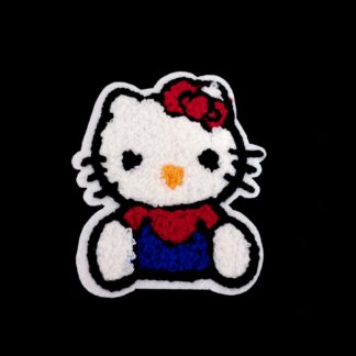 Red yellow black and blue Hello Kitty on white garment applique by piece - size 73 x 88 mm