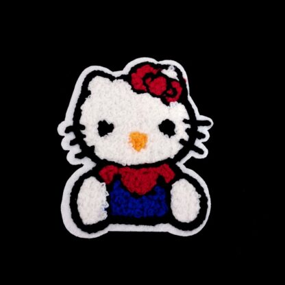 Red yellow black and blue Hello Kitty on white garment applique by piece - size 73 x 88 mm