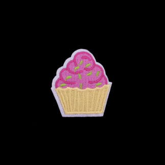 Pink green and yellow cupcake on white iron-on garment sticker by piece - size 42 x 49 mm