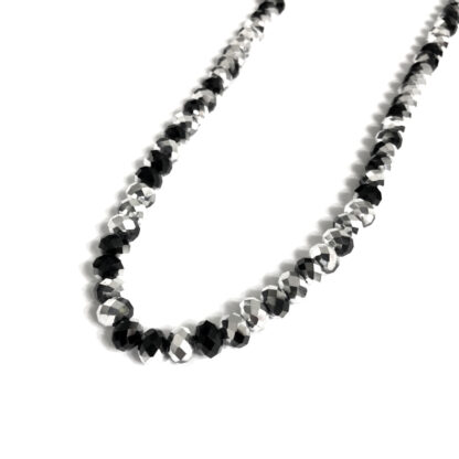Faceted round silvery and black beads by strand - diametre 8 mm - length 41 cm