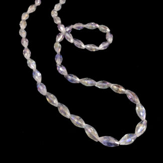 Faceted oval iridescent transparent beads by strand - size 6 x 12 mm - length 60 cm