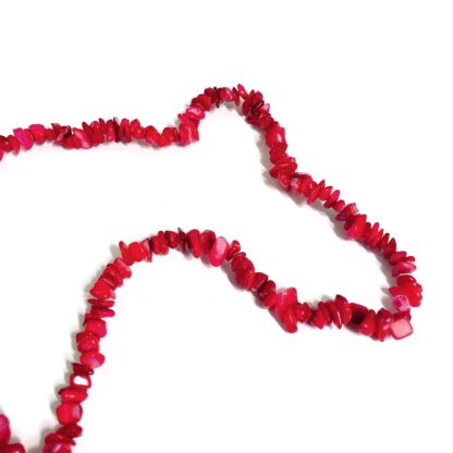 Pinkish red stone beads by strand - size 6 x 10 mm - length 49 cm