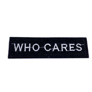 Silvery words WHO CARES on black rectangular iron-on garment sticker by piece - size 30 x 100 mm