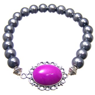 Oval bluish pink cabochon on silvery metal base dark grey beads bracelet - diametre 8 mm