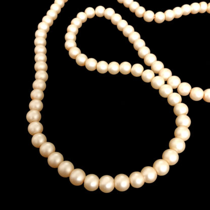 Round yellowish beige beads by strand - diametre 8 mm - length 80 cm