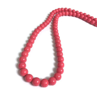 Round reddish pink beads by strand - diametre 10 mm - length 80 cm