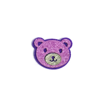 Glittery pink bear head with green nose on purple felt decoration by piece - size 31 x 37 mm