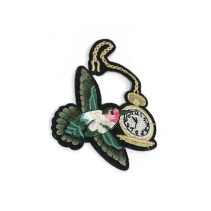 Colourful green bird and golden and white clock on black iron-on garment sticker by piece - size 85 x 120 mm