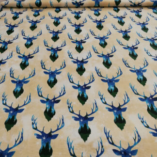 Stag night exposure blue and green heads with antlers on tan print pure cotton quilting fabric - width 110 cm