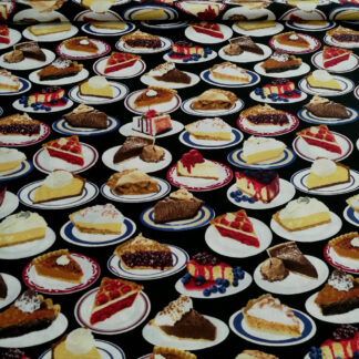 Various cakes on plates on black print pure cotton quilting fabric - width 110 cm
