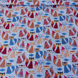Colourful foxes with blue leaves on maya blue print pure cotton quilting fabric - width 110 cm